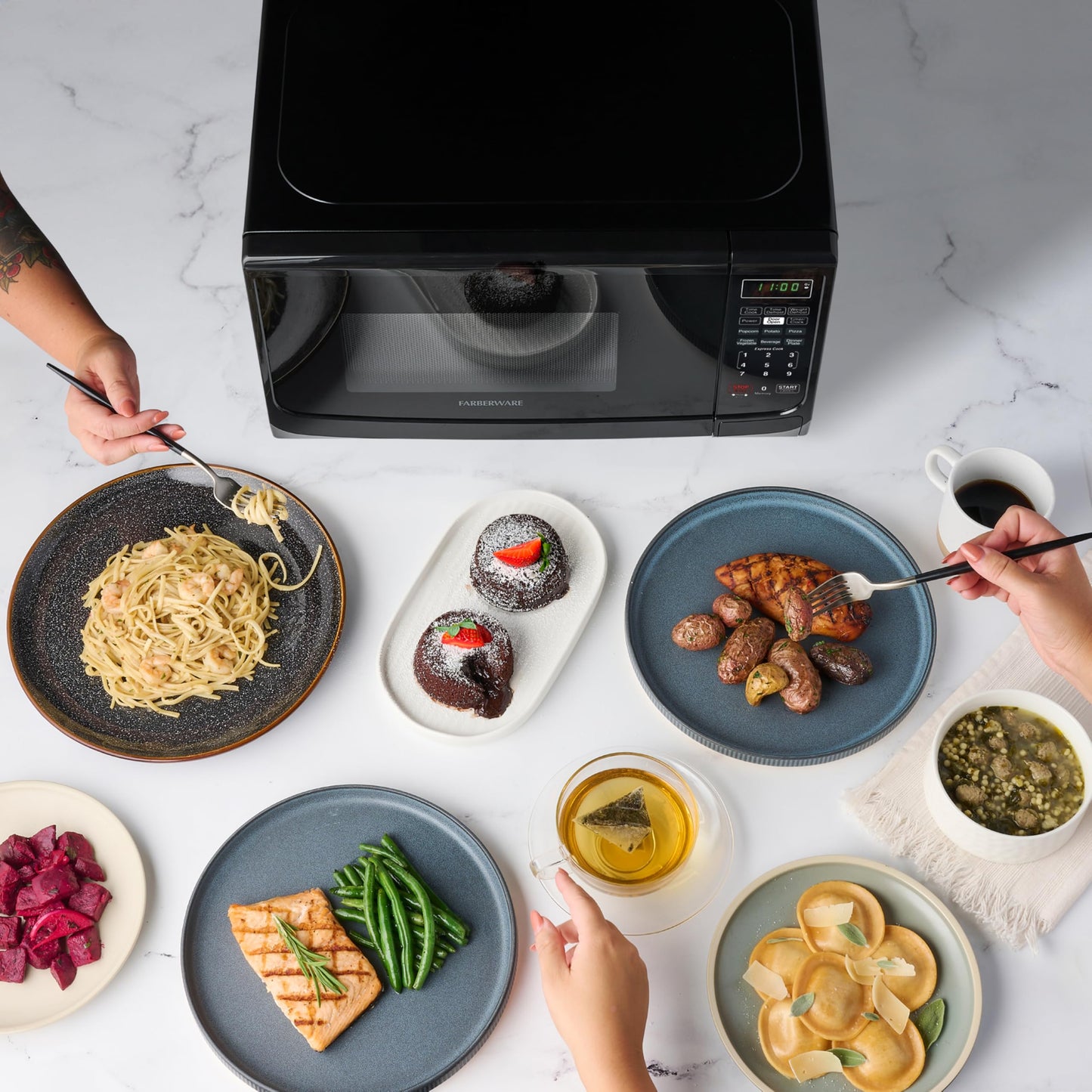 Farberware 0.7 Cu. Ft. Countertop Microwave Oven – 700 Watts Power, Auto Cook Settings, Defrost, Easy Clean and Child Safety Lock - Black